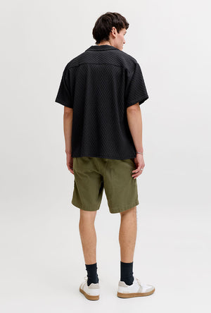 Back image of a model wearing the Sean resort shirt in black, by brand Jack&jones