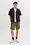 Front image of a model wearing the Sean resort shirt in black, by brand Jack&jones