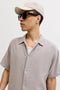 Front image of a model wearing the Soft base seersucker in beige, by brand Jack&jones