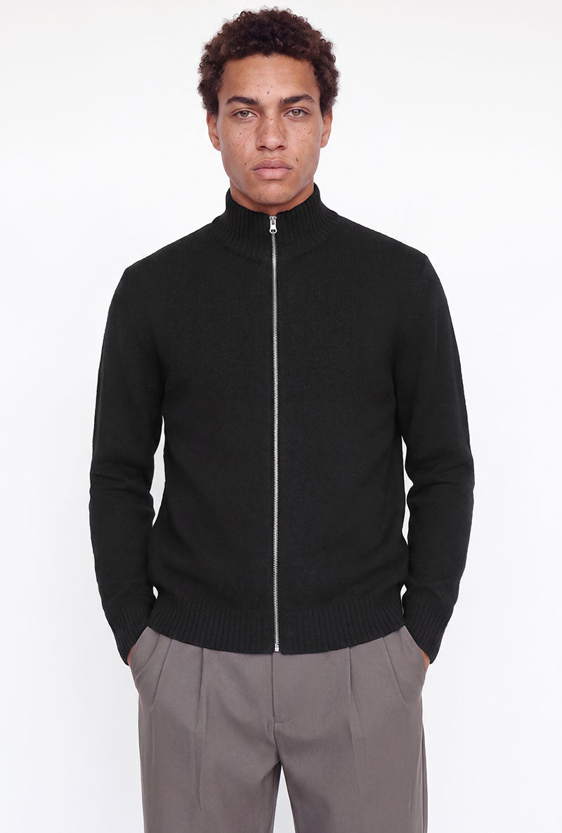 Front image of a model wearing Soho ollie high neck zip knit in black, by brand Jack&jones