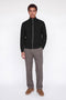 Front image of a model wearing the Soho ollie high neck zip knit in black, by brand Jack&jones