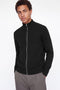 Front image of a model wearing the Soho ollie high neck zip knit in black, by brand Jack&jones