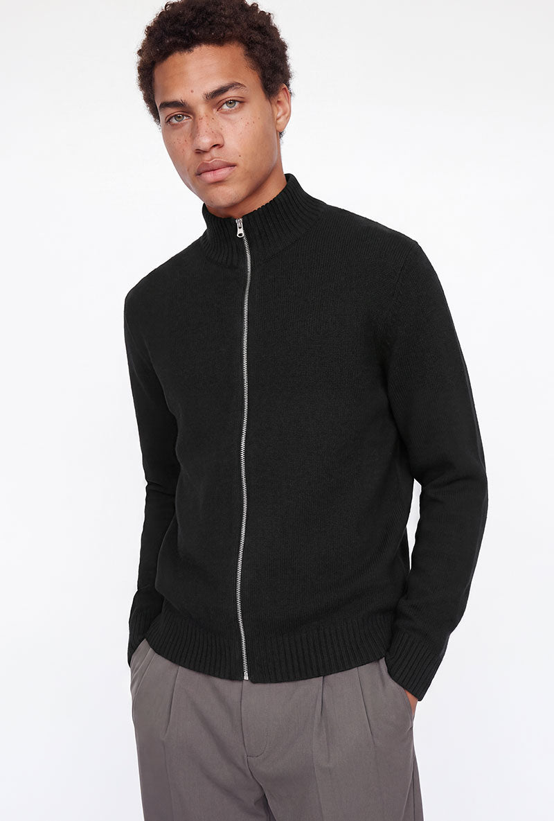 Front image of a model wearing Soho ollie high neck zip knit in black, by brand Jack&jones