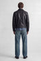 Back image of a model wearing the Ted jj cooper am559 jeans in denim, by brand Jack&jones