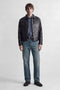 Front image of a model wearing the Ted jj cooper am559 jeans in denim, by brand Jack&jones