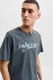 Front image of a model wearing the Tom tee ss crew neck in charcoal, by brand Jack&jones