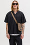 Front image of a model wearing Tyson resort shirt in black, by brand Jack&jones
