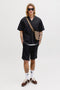 Front image of a model wearing the Tyson resort shirt in black, by brand Jack&jones