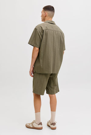 Back image of a model wearing the Tyson resort shirt in khaki, by brand Jack&jones