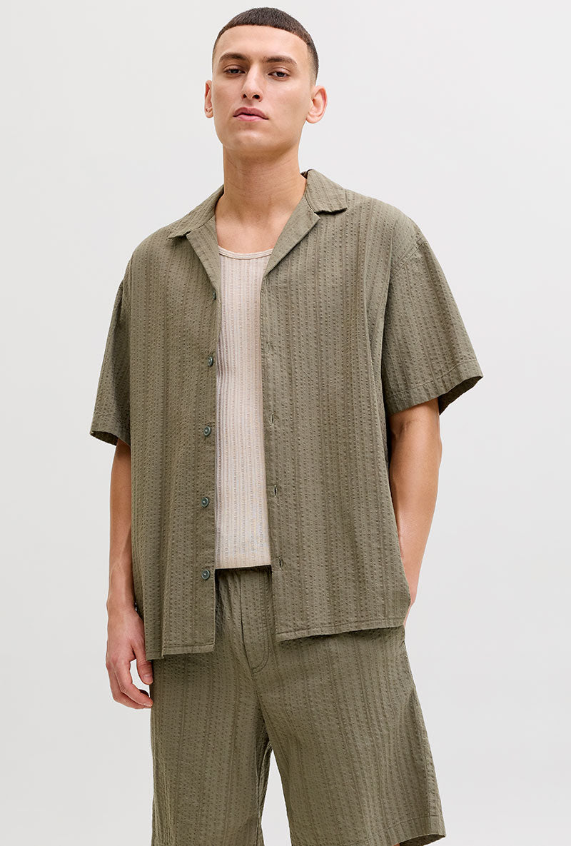 Front image of a model wearing Tyson resort shirt in khaki, by brand Jack&jones