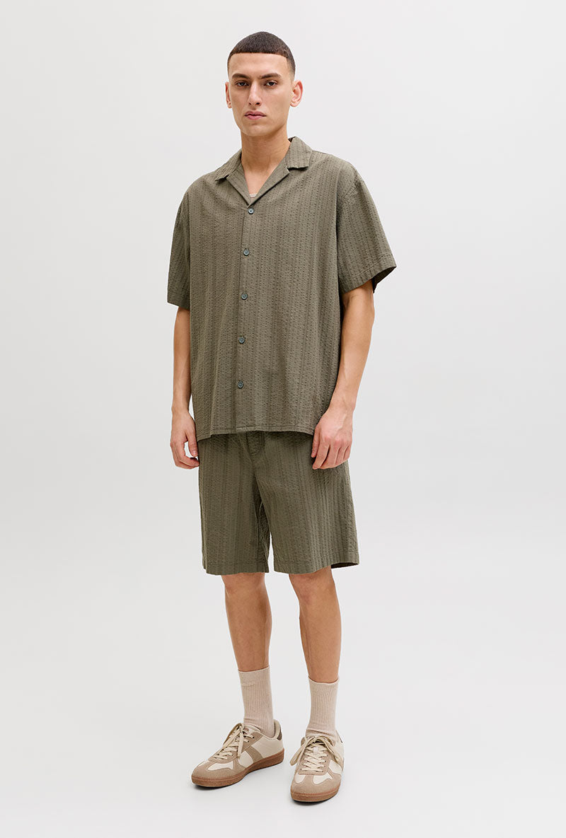 Front image of a model wearing Tyson resort shirt in khaki, by brand Jack&jones