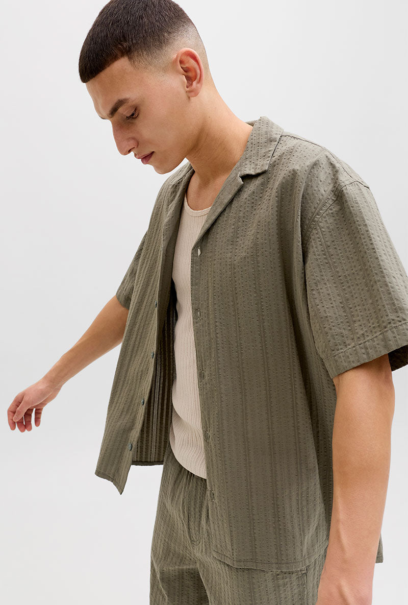Front image of a model wearing Tyson resort shirt in khaki, by brand Jack&jones