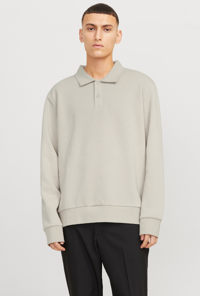 Front image of a model wearing Jack and jones bradley sweat polo in stone, by brand Jack&jones