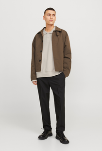 Front image of a model wearing the Jack and jones bradley sweat polo in stone, by brand Jack&jones