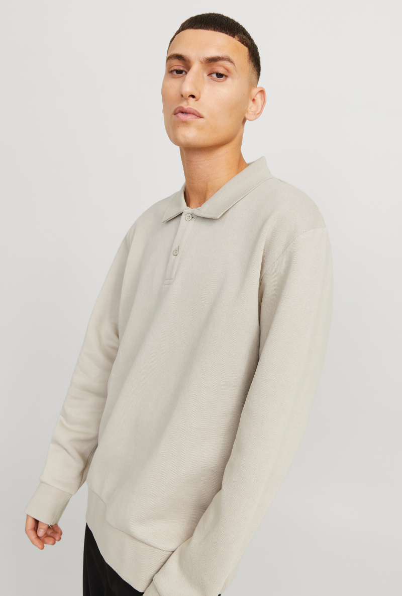 Front image of a model wearing Jack and jones bradley sweat polo in stone, by brand Jack&jones