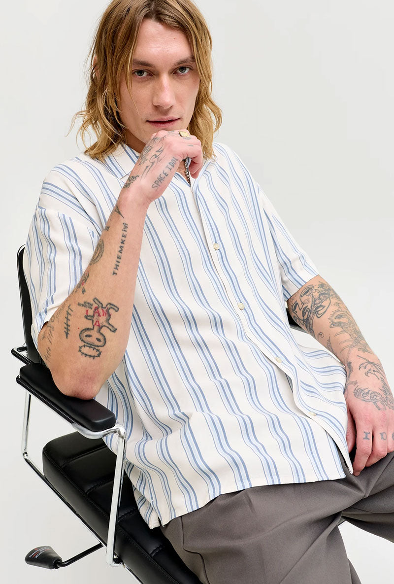 Front image of a model wearing Jeff resort stripe shirt in blue, by brand Jack&jones