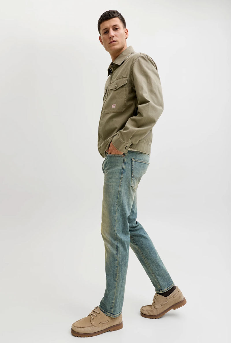 Side image of a model wearing Mike original st 550 jeans in denim, by brand Jack&jones