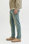 Side image of a model wearing the Mike original st 550 jeans in denim, by brand Jack&jones