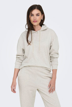 Front image of a model wearing Amalfi life ls hood in oat, by brand Jacqueline de yong