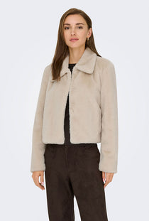 Front image of a model wearing the Macy faux fur jacket in beige, by brand Jacqueline de yong