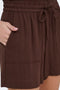 Front image of a model wearing the Mille mw shorts in brown, by brand Jacqueline de yong