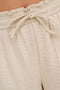 Front image of a model wearing the Mille mw shorts in beige, by brand Jacqueline de yong