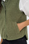 Front image of a model wearing the Simina teddy waistcoat in olive, by brand Jacqueline de yong