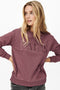 Front image of a model wearing the Paris l/s glitter sweatshirt in burgundy, by brand Jacqueline de yong
