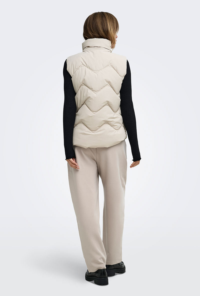Back image of a model wearing Power short waistcoat in beige, by brand Jacqueline de yong
