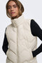 Front image of a model wearing the Power short waistcoat in beige, by brand Jacqueline de yong