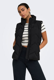 Front image of a model wearing the Power short waistcoat in black, by brand Jacqueline de yong