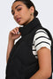 Front image of a model wearing the Power short waistcoat in black, by brand Jacqueline de yong