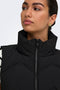 Front image of a model wearing the Power short waistcoat in black, by brand Jacqueline de yong