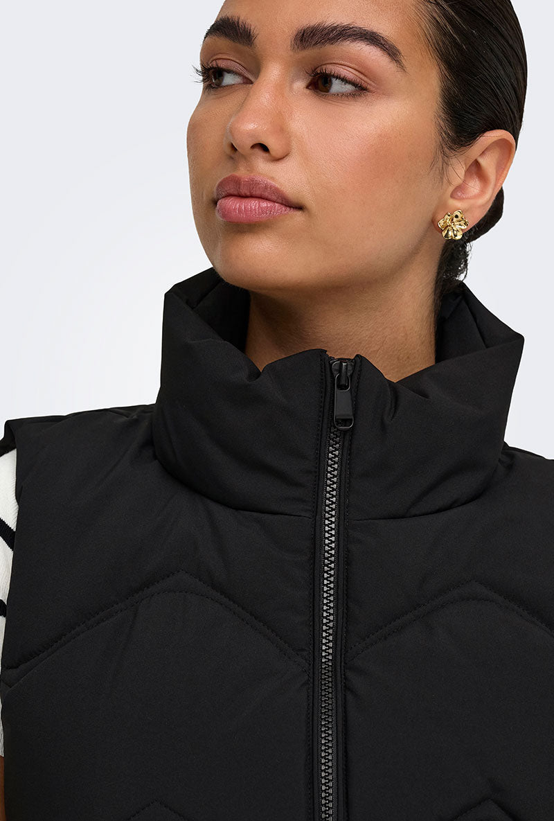 Front image of a model wearing Power short waistcoat in black, by brand Jacqueline de yong