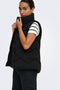 Front image of a model wearing the Power short waistcoat in black, by brand Jacqueline de yong