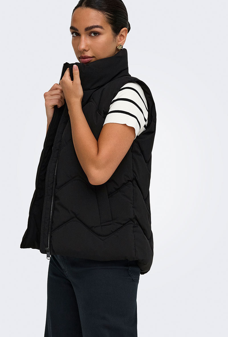 Front image of a model wearing Power short waistcoat in black, by brand Jacqueline de yong