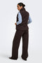 Back image of a model wearing the Power short waistcoat in chocolate, by brand Jacqueline de yong