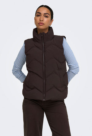 Front image of a model wearing the Power short waistcoat in chocolate, by brand Jacqueline de yong