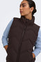 Front image of a model wearing the Power short waistcoat in chocolate, by brand Jacqueline de yong