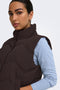 Front image of a model wearing the Power short waistcoat in chocolate, by brand Jacqueline de yong