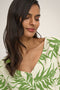 Front image of a model wearing the Sezen life s/s knot shrit in green, by brand Jacqueline de yong