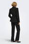 Back image of a model wearing the Storm ls buckle blazer in black, by brand Jacqueline de yong