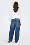 Back image of a model wearing the Susie mw barrel jeans in denim, by brand Jacqueline de yong