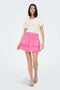 Front image of a model wearing the Theis life hw smock skirt in pink, by brand Jacqueline de yong