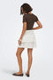 Back image of a model wearing the Theis life hw smock skirt in white, by brand Jacqueline de yong