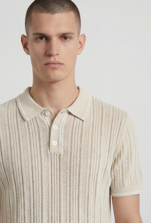 Front image of a model wearing the Deep river button knit polo in beige, by brand Deep
