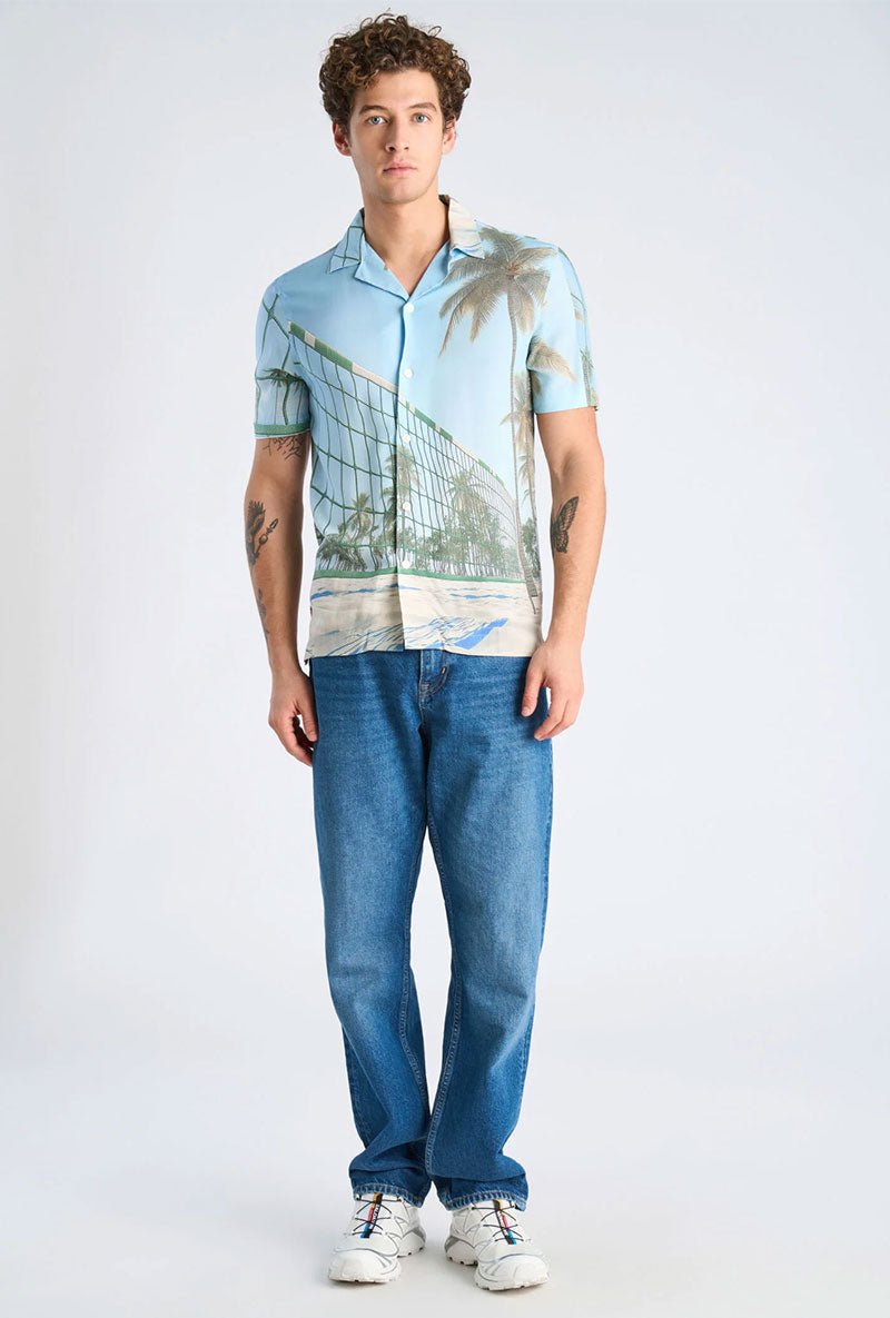 Front image of a model wearing Aop summer viscose shirt in sky, by brand Lindbergh