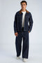 Front image of a model wearing the Corduroy collar overshirt in dark denim, by brand Lindbergh