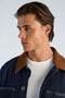 Front image of a model wearing the Corduroy collar overshirt in dark denim, by brand Lindbergh
