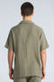 Back image of a model wearing the Cotton muslin resort shirt in sage, by brand Lindbergh